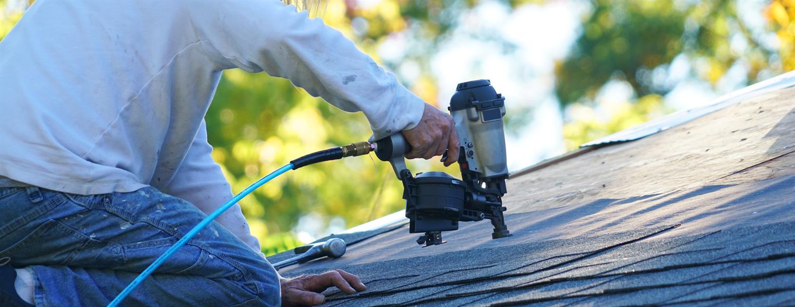 Technician fixing a roof